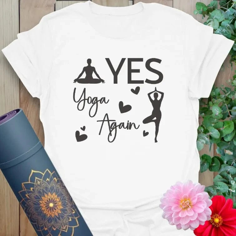 Flatlay of white Again T-Shirt with minimalist “YES YOGA AGAIN” design and tree pose graphic for peaceful expression crafted with love by Ramro.