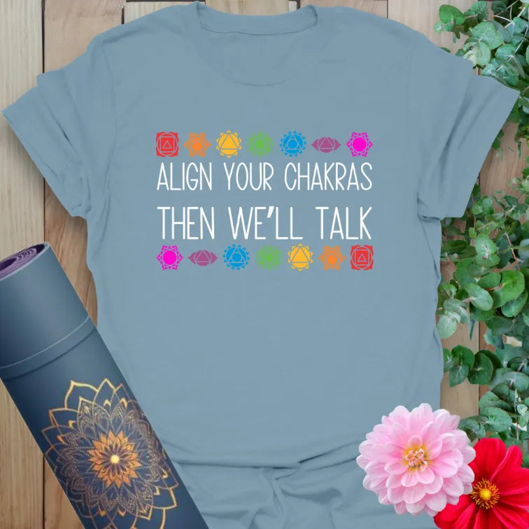 Align Your Chakras T-Shirt in Stone Blue featuring energy symbols and “Align Your Chakras” mantra.