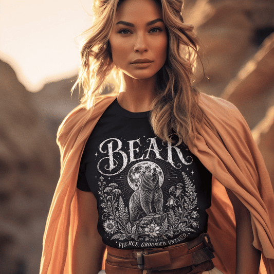 Ramro Yoga Wear Bear tee in Black — bear full moon botanical vintage design, desert golden rocks lifestyle shot