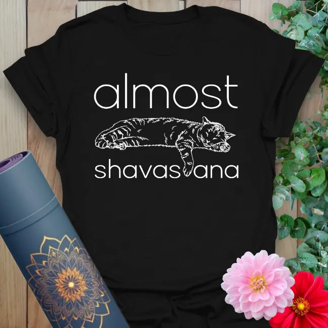 Designed by Ramro Yoga Wear, this is our Black Almost Shavasana T-Shirt – yoga lifestyle t-shirt with lighthearted design for spiritual seekers.