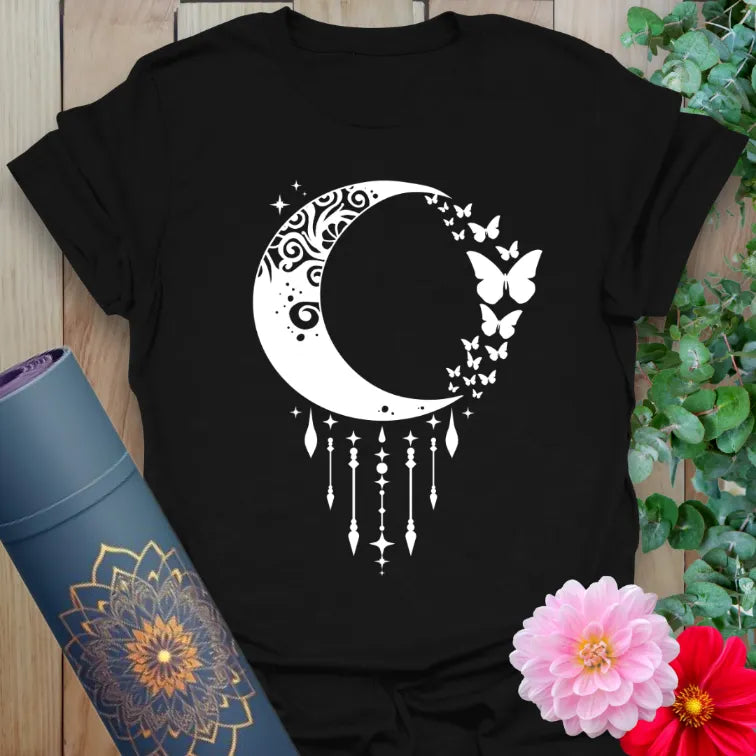 Black yoga t-shirt with intricate crescent moon, stardust trails, and butterfly design