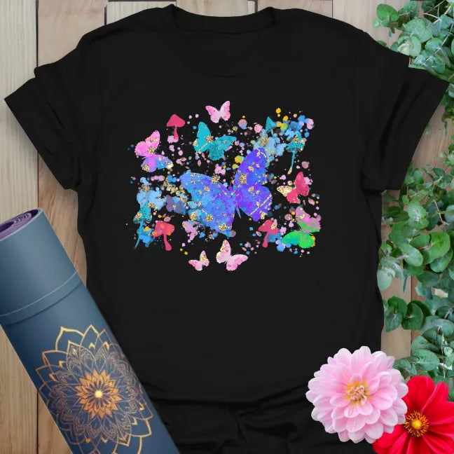 Classic black cotton yoga t-shirt with vibrant butterfly and nature design for lively, conscious, adventurous living.