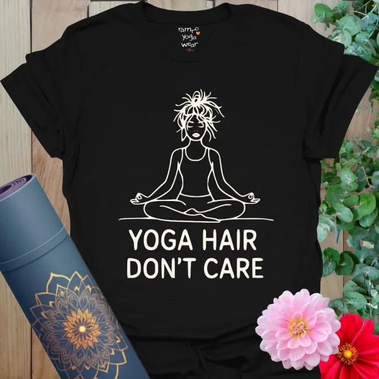 Black Hair T-Shirt with playful design of a yogi in meditation pose and messy bun hair. Slogan: “Yoga Hair Don’t Care.” Fun yoga lifestyle tee.