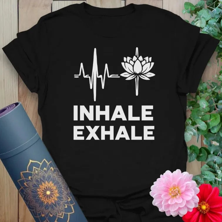 Classic black cotton yoga t-shirt showcasing heartbeat line, lotus blossom, and mindful breathing mantra for conscious living.