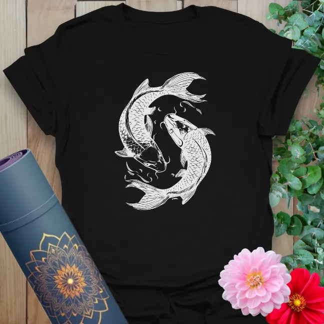 Classic black cotton yoga t-shirt showcasing graceful yin-yang koi fish design for conscious movement and mindful living.