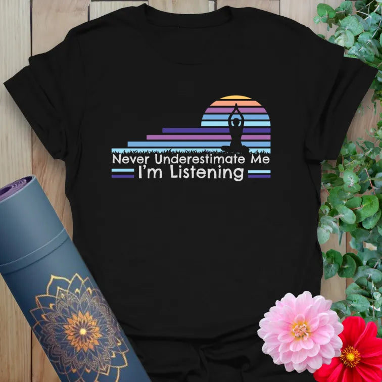 Classic black cotton yoga t-shirt showcasing powerful "I'm Listening" quote with colorful retro yoga design.