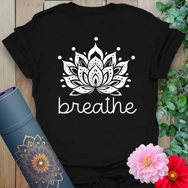 Classic black cotton yoga t-shirt with white lotus flower and "breathe" design encouraging soulful, grounded mindfulness.