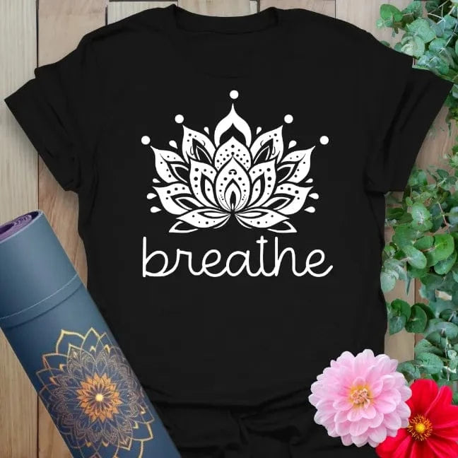 Classic black cotton yoga t-shirt with white lotus flower and "breathe" design encouraging soulful, grounded mindfulness.