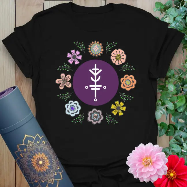 Classic black cotton yoga t-shirt showcasing colorful flower circle and sacred luck symbol for soulful, vibrant living.