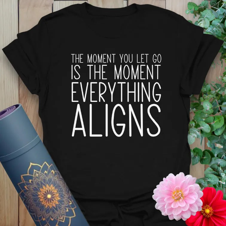 Classic black cotton yoga t-shirt showcasing empowering "let go and align" message perfect for conscious, mindful living.