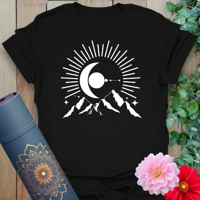 Classic black cotton yoga t-shirt showcasing radiant moonrise and mountain landscape inspiring mindful exploration and spiritual connection.