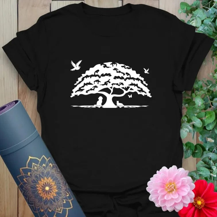 Classic black cotton yoga t-shirt showcasing grounded oak tree design symbolizing resilience, heart-centered living, and soulful presence.