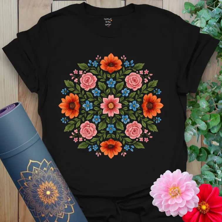 Classic black cotton yoga t-shirt showcasing bright floral mandala for creative, conscious, soul-centered living.