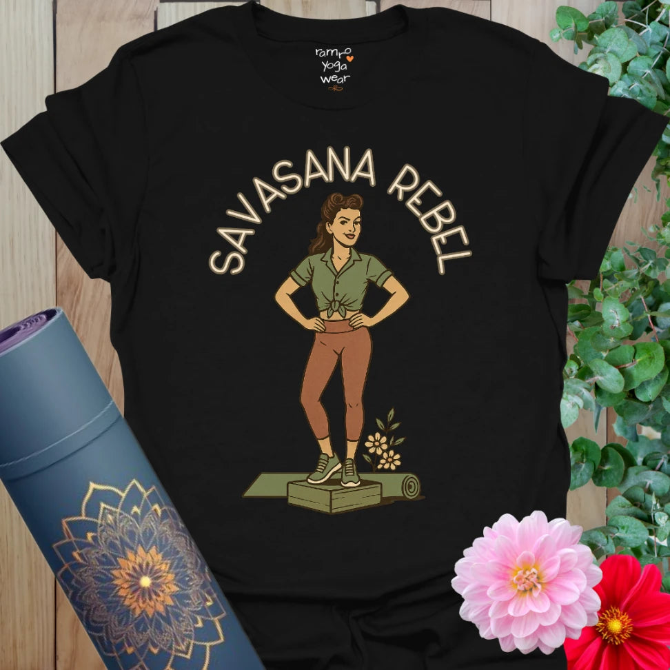Black unisex yoga t-shirt featuring pinup yogi graphic and rebellious āSavasana Rebelā message.