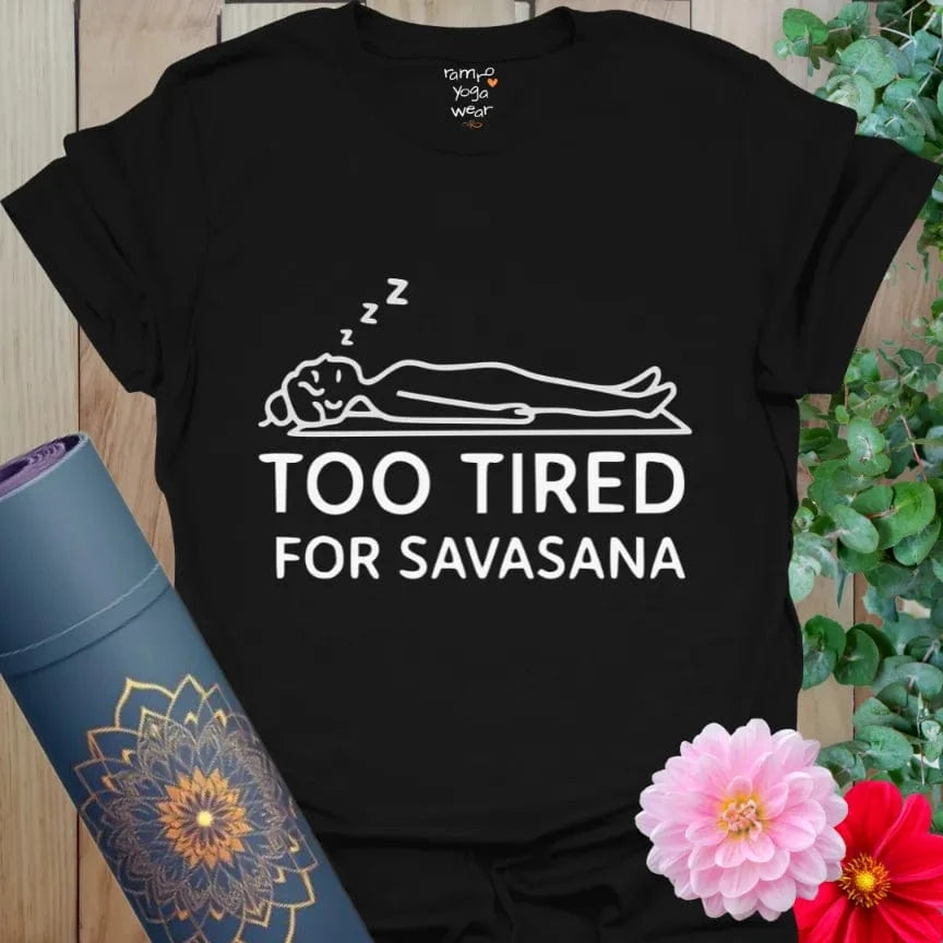 Black Too Tired T-Shirt with bold white line drawing of yogi in Savasana pose and zzz’s. Funny yoga lifestyle shirt.