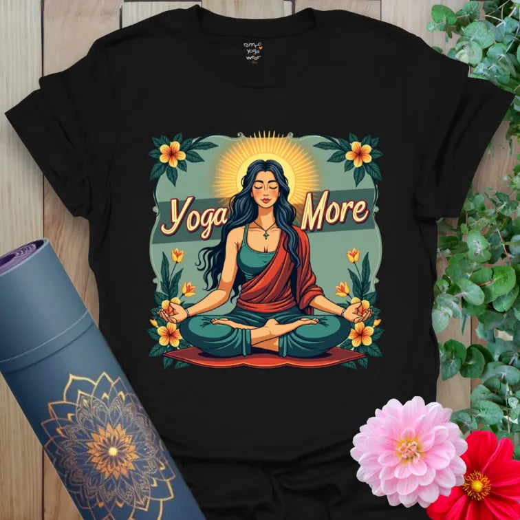 Classic black cotton tee with colorful goddess figure and “Yoga More” quote for bold spiritual expression.