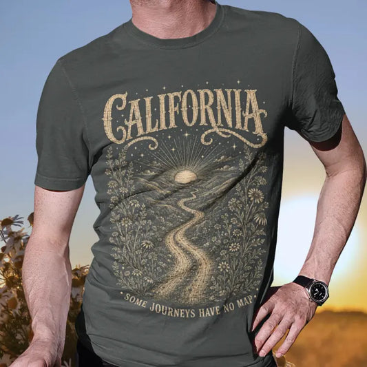 Person wearing a short sleeved tee called California in Dark Heather Grey. A sacred yoga shirt at golden hour in an open field — Sacred Thread collection by Ramro Yoga Wear
