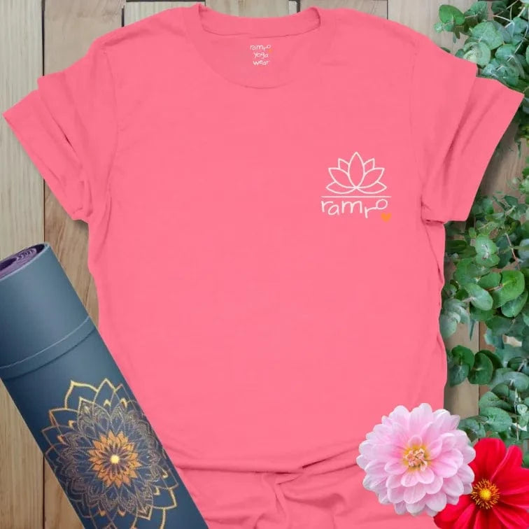 Coral Silk Beautiful Flow T-Shirt featuring a white lotus design with Ramro logo and heart. Mindful yoga tee with uplifting energy.