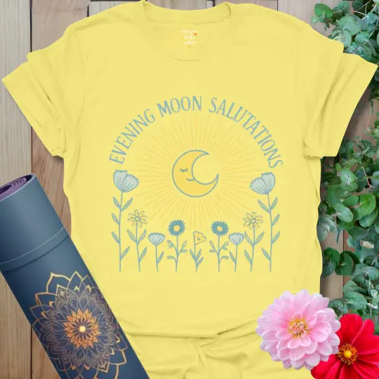 Cornsilk Evening Moon Salutations T-Shirt featuring warm golden moon rays and pastel flowers. Retro-inspired yoga tee with a serene, boho feel.