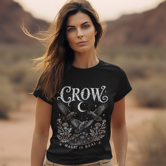 Ramro Yoga Wear Crow tee in Black — lifestyle shot, desert mountains, crow crescent moon botanical vintage engraving