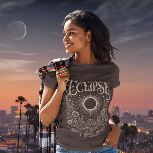 Ramro Yoga Wear Eclipse tee in Dark Chocolate — solar eclipse botanical vintage design, city skyline sunset lifestyle shot
