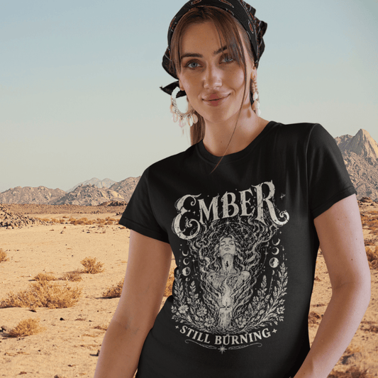 Ramro Yoga Wear Ember tee in Black — woman in flame moon phases botanical vintage design, desert mountains lifestyle shot