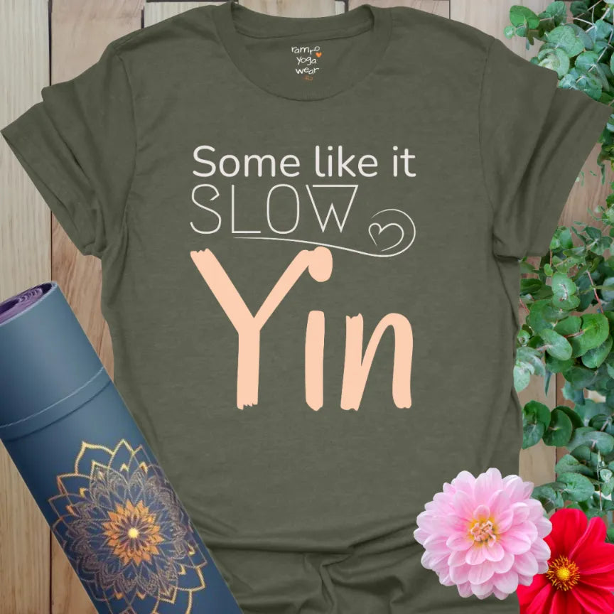 Heather Military Green Yin T-Shirt featuring “Some Like It Slow – Yin” in soft peach script. Earthy, restorative tee for yin lovers.