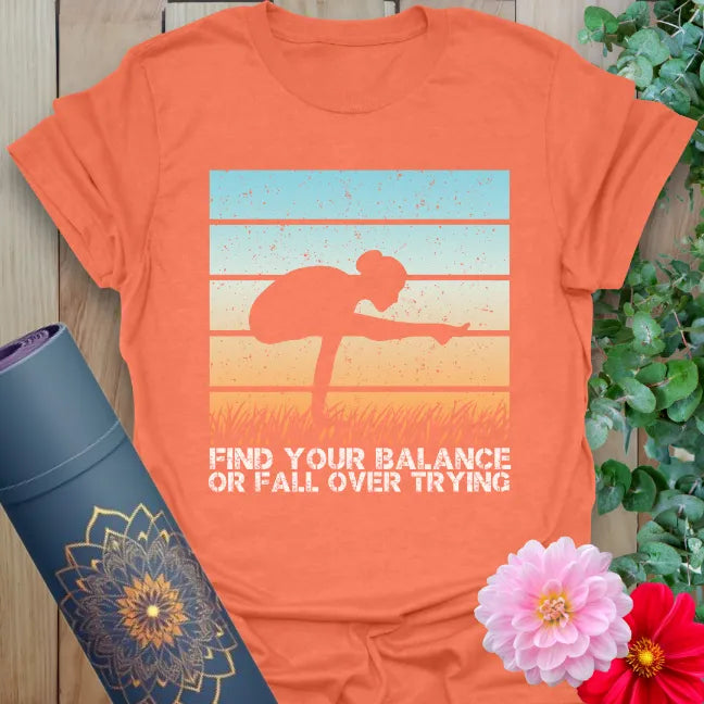 Vibrant orange yoga shirt with “find your balance” quote and yoga-inspired art