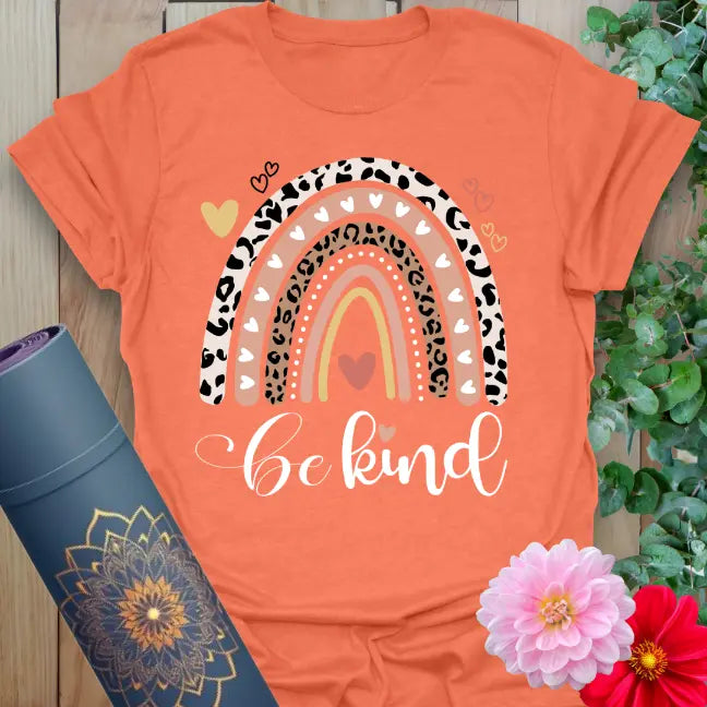 Heather orange t-shirt with warm retro rainbow and uplifting be kind text