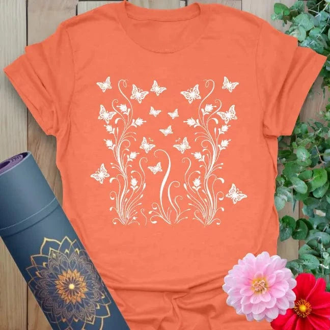 Heather orange yoga tee with uplifting butterfly and botanical graphic