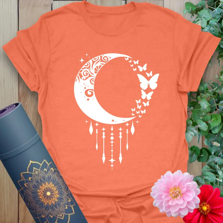Heather orange t-shirt with mystical crescent moon and butterfly transformation imagery