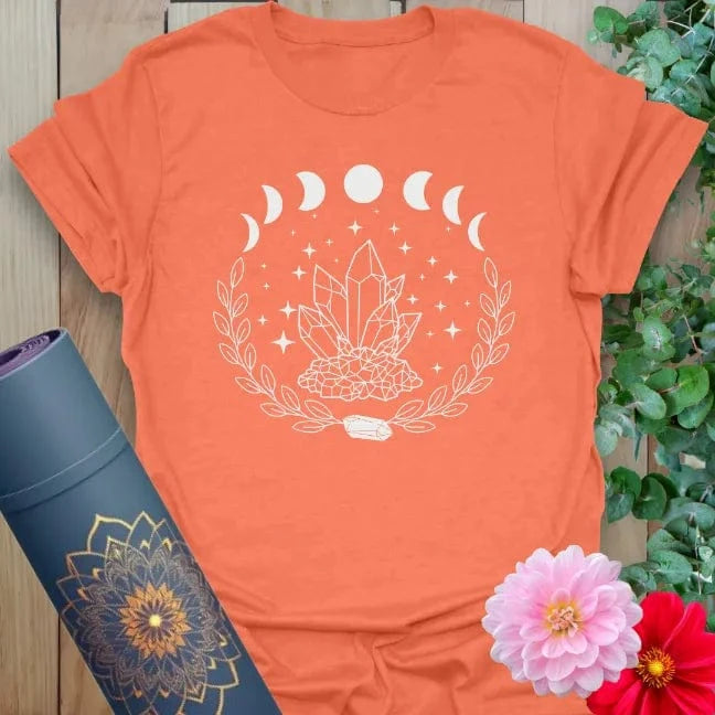 Heather orange t-shirt with radiant crystal cluster and cosmic symbolism