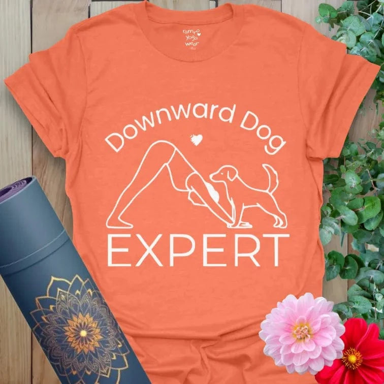 Heather Orange Dog Expert T-Shirt with yoga pose and dog design. Perfect gift for yogis and pet lovers.