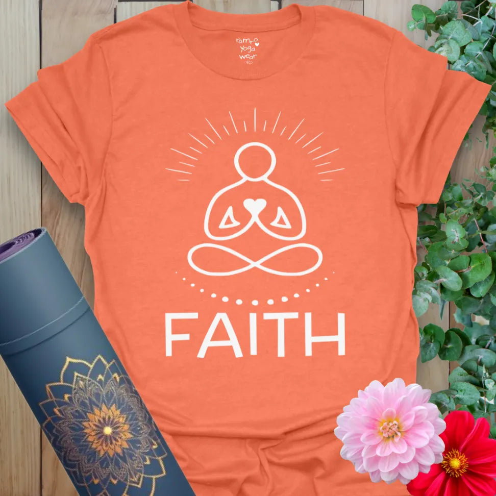 Vibrant orange yoga t-shirt with meditation silhouette, heart design, and inspirational "Faith" message.