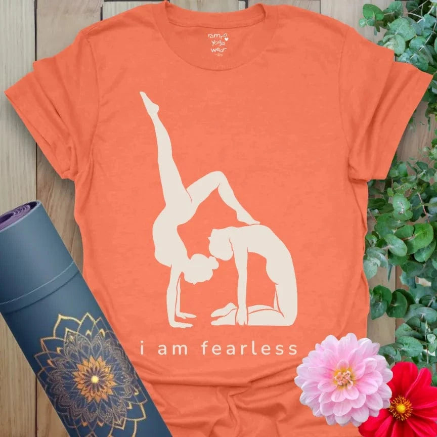Heather Orange Fearless T-Shirt featuring “I Am Fearless” slogan and yogi silhouette. Vibrant yoga gift tee for empowerment and mindful movement.