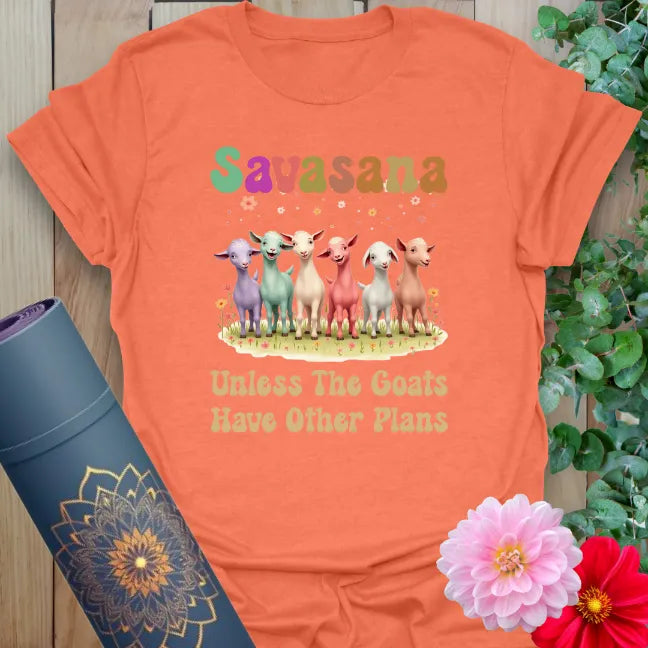 Vibrant orange yoga t-shirt showcasing funny goat illustration and yoga humor for joyful, conscious movement.