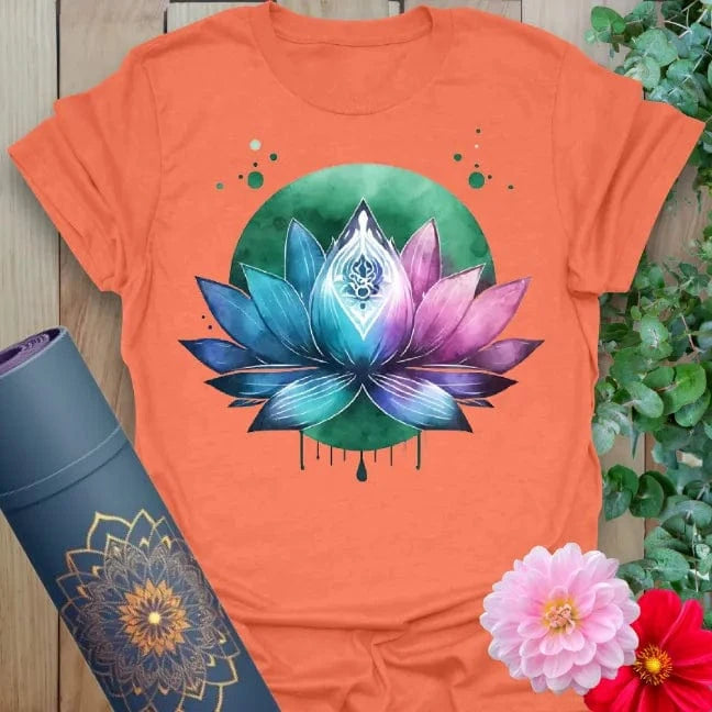 Vibrant orange yoga t-shirt showcasing colorful lotus flower and glowing background for spiritual awakening and conscious movement.