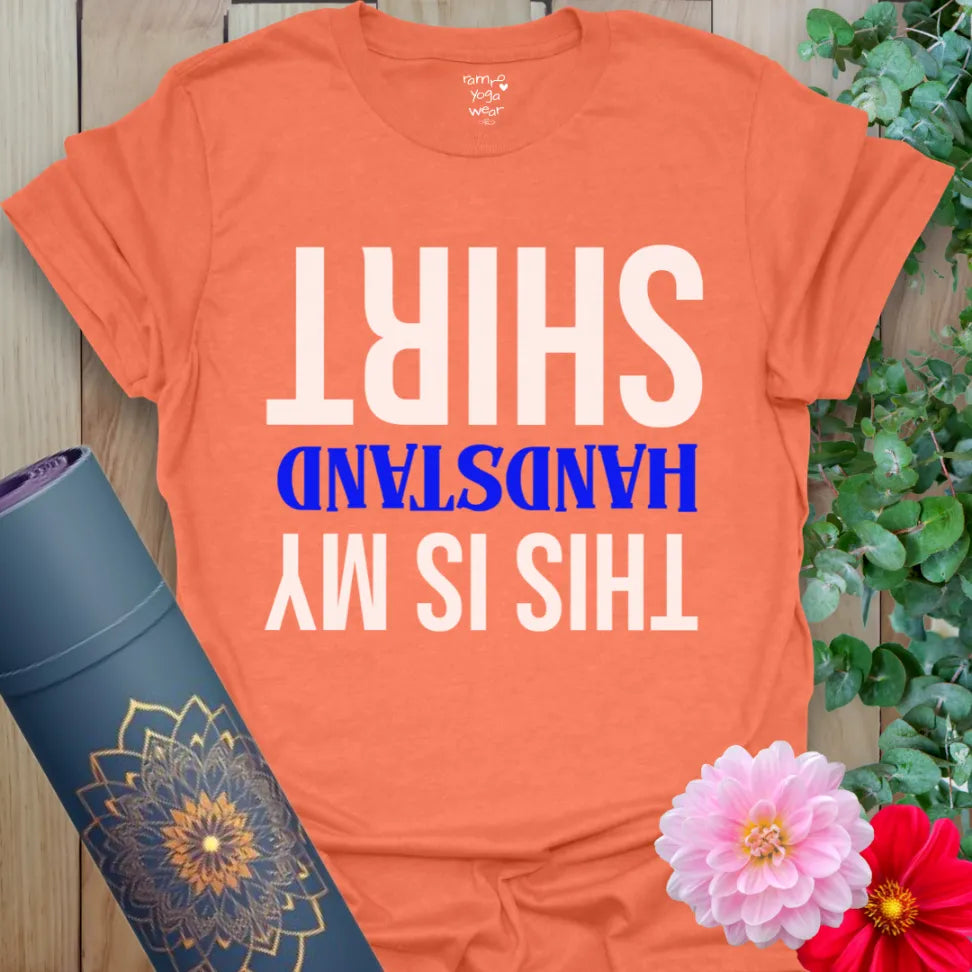 Vibrant orange yoga t-shirt showcasing funny upside-down yoga quote inspiring fearless, conscious living.
