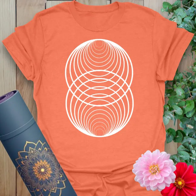 Vibrant orange yoga t-shirt showcasing sacred geometric balance design for conscious, mindful movement.