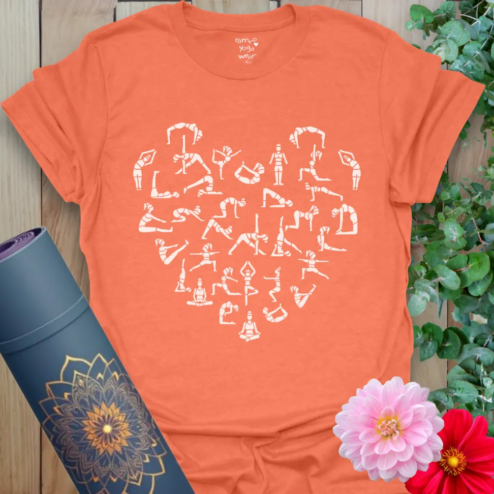 Vibrant orange yoga t-shirt showcasing flowing yoga pose heart illustration for joyful, conscious living.