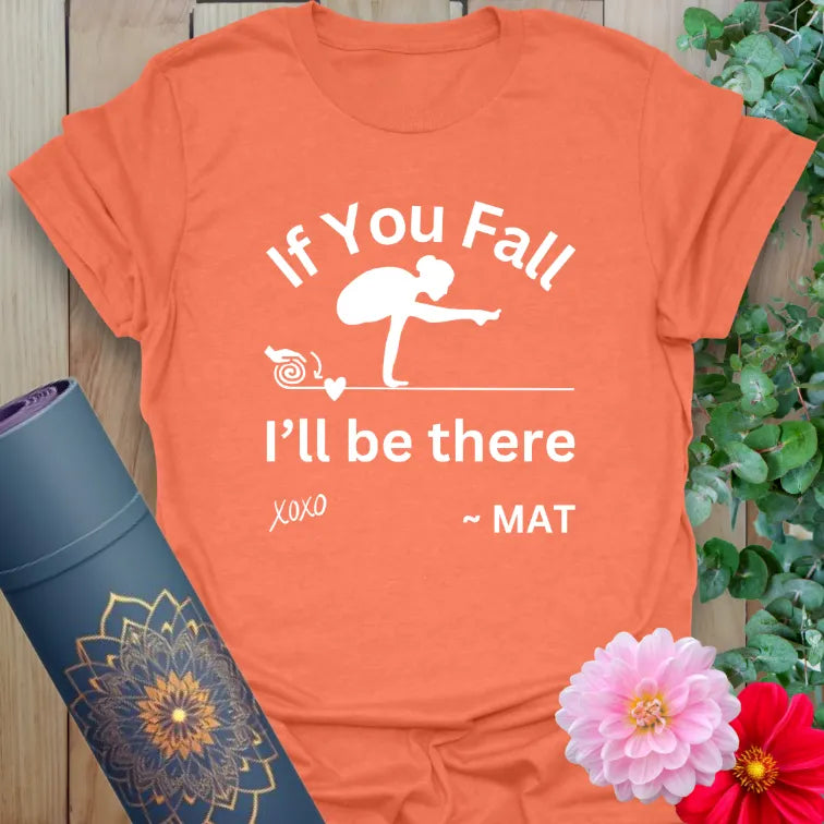 Vibrant orange yoga t-shirt showcasing funny yoga mat quote with crow pose illustration for mindful movement and laughter.