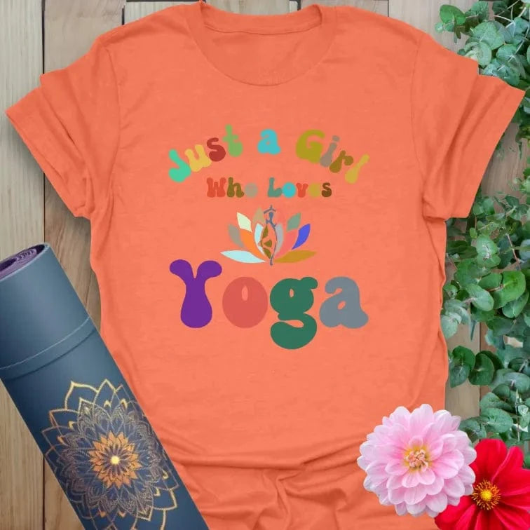 Vibrant orange yoga t-shirt showcasing playful multicolor yoga graphic perfect for light-hearted, soulful living.