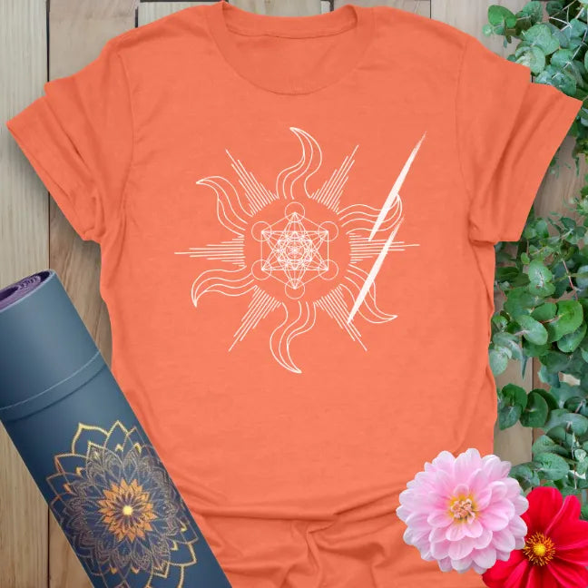 Vibrant orange yoga t-shirt showcasing mystical swirling sacred design with lightning bolt accents for mindful, powerful living.