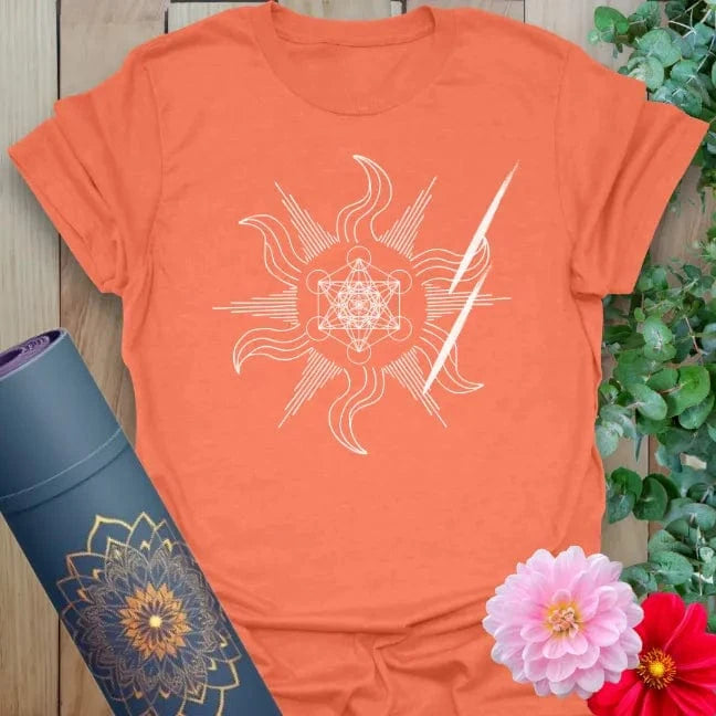 Vibrant orange yoga t-shirt showcasing mystical swirling sacred design with lightning bolt accents for mindful, powerful living.