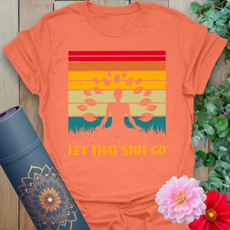 Vibrant orange yoga t-shirt showcasing colorful sunset design and playful soulful mantra for conscious, joyful living.