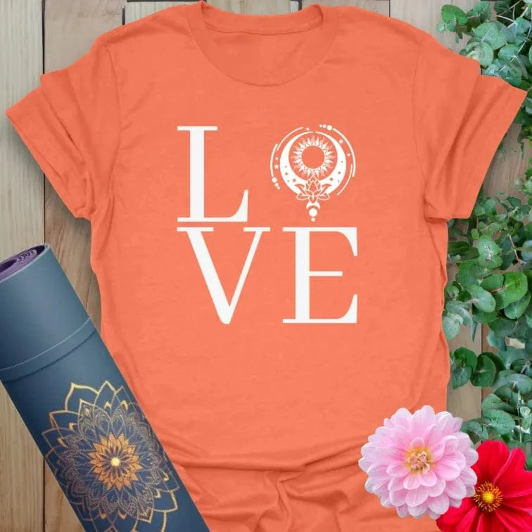 Vibrant orange yoga t-shirt showcasing spiritual "LOVE" design with mandala-inspired circle for soulful connection.