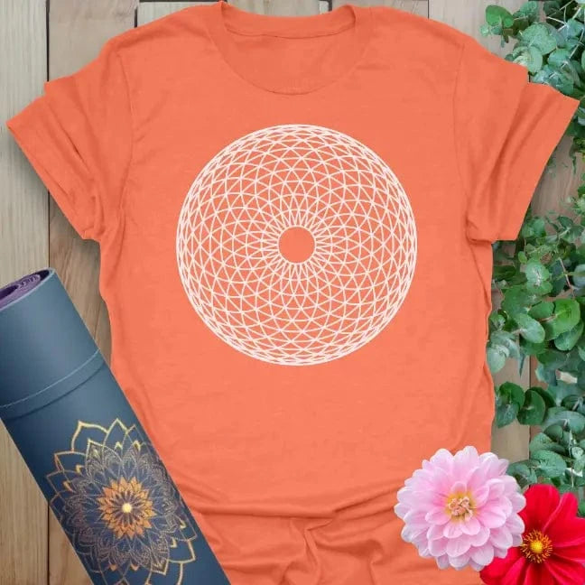 Vibrant orange yoga t-shirt showcasing sacred circular pattern inspiring mindful manifestation and soulful alignment.