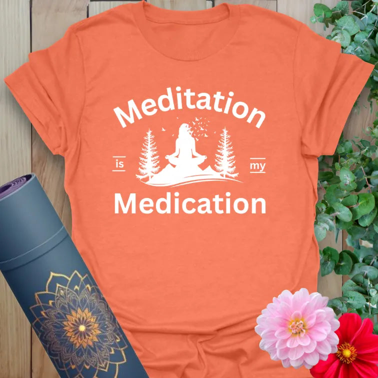 Vibrant orange yoga t-shirt showcasing playful meditation and forest artwork inspiring mindful healing and peaceful movement.