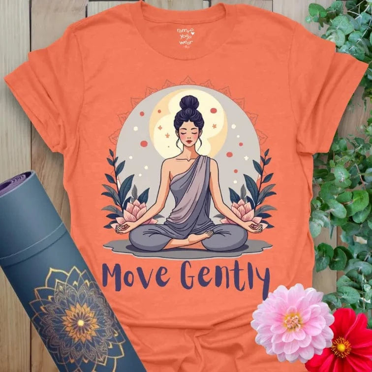Vibrant orange yoga t-shirt showcasing peaceful meditation figure and mindful movement quote for heart-centered, conscious presence.