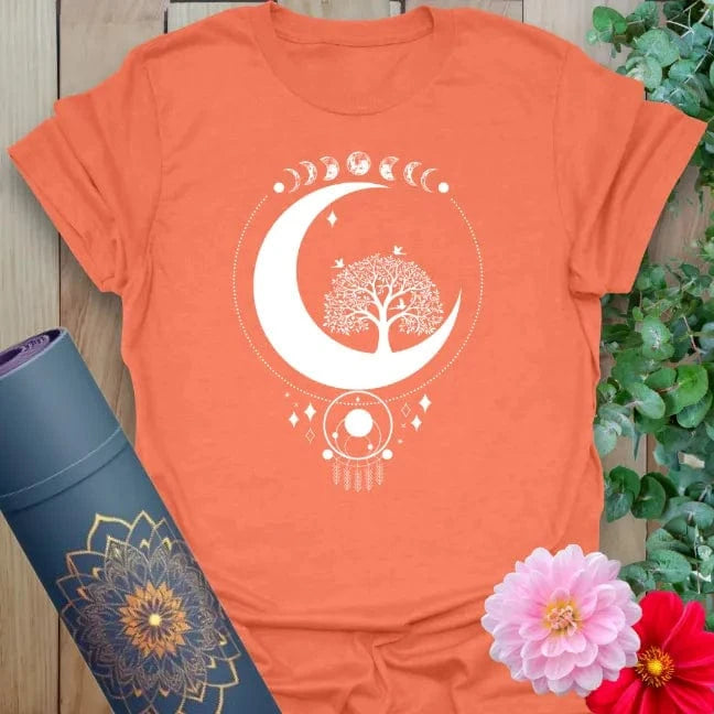 Vibrant orange yoga t-shirt showcasing sacred moon, tree of life, and dreamcatcher design inspiring soulful balance and spiritual expansion.
